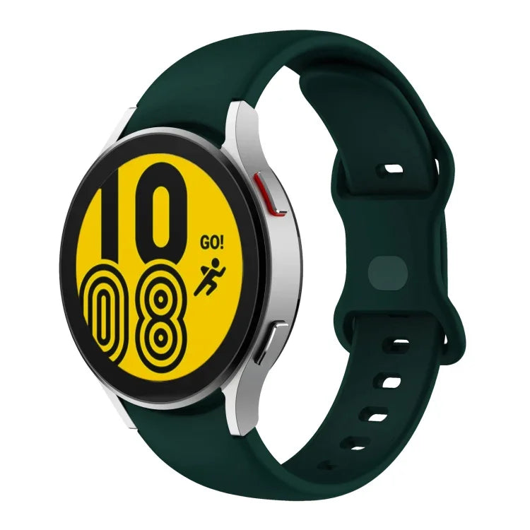 Butterfly buckle silicone watch band for Samsung Galaxy Watch4 on green strap, displaying digital time and activity.